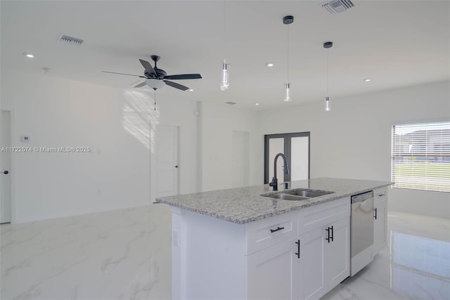 kitchen with sink, light stone counters, an island with sink, dishwashing machine, and white cabinets