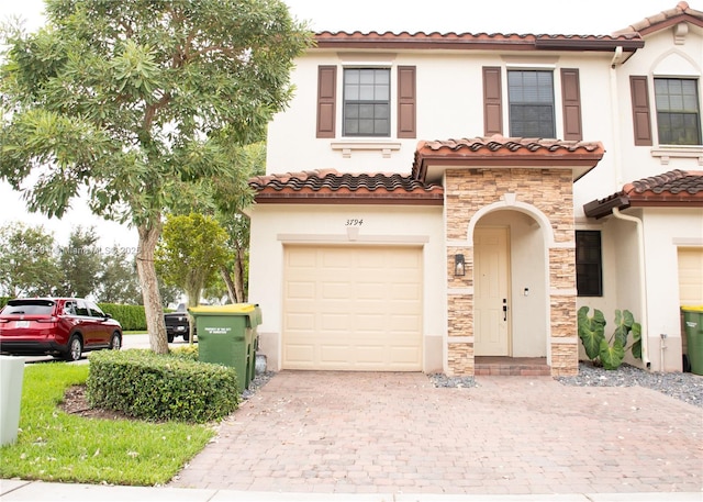 mediterranean / spanish-style home featuring a garage