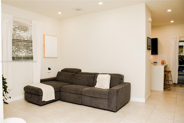 living room with light tile patterned floors