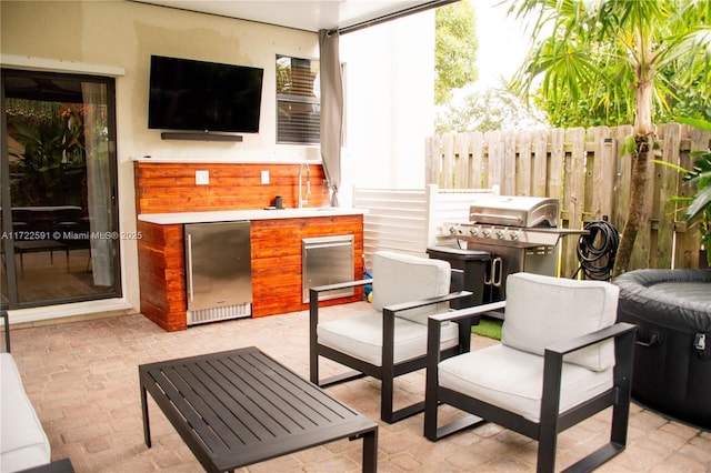 view of patio featuring exterior kitchen