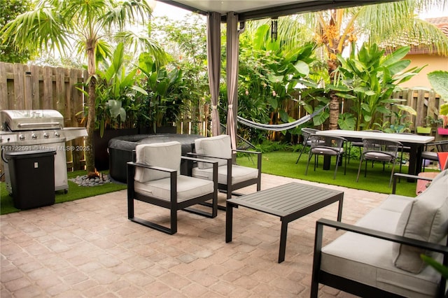 view of patio with grilling area and an outdoor living space