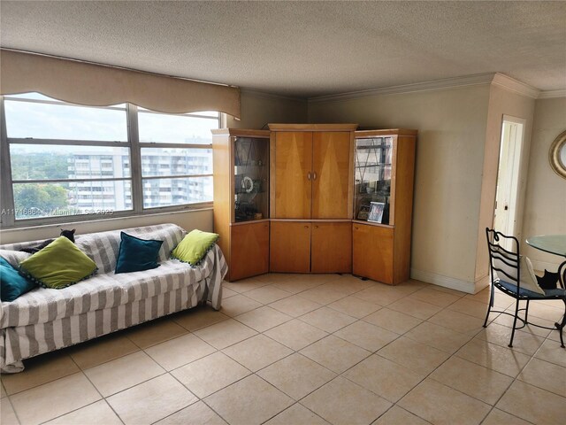 1351 NE Miami Gardens Dr Unit 1025E, Miami, FL 33179 - living room with ornamental molding, light tile patterned floors, and a textured ceiling