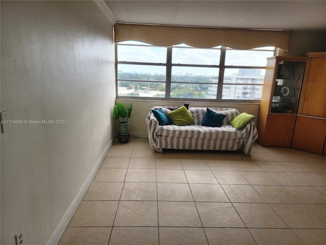 1351 NE Miami Gardens Dr Unit 1025E, Miami, FL 33179 - living room with light tile patterned floors, baseboards, and ornamental molding