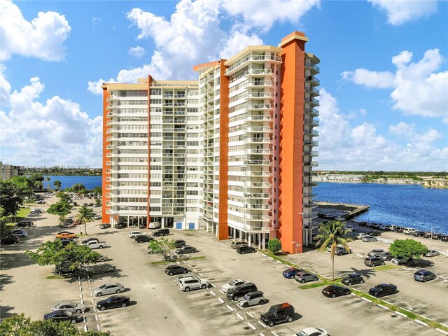 1351 NE Miami Gardens Dr Unit 1025E, Miami, FL 33179 - view of apartment building / complex featuring a water view and uncovered parking