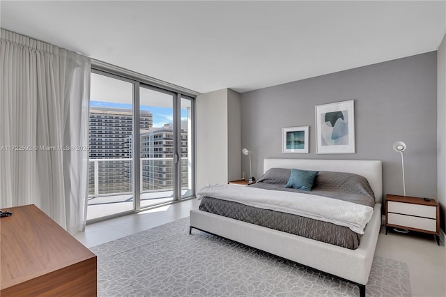 bedroom featuring access to exterior, expansive windows, and light tile patterned flooring