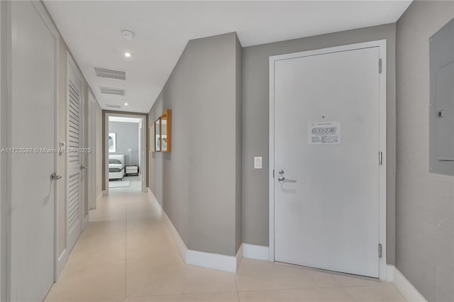 corridor with light tile patterned flooring