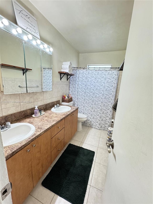 bathroom with tile patterned floors, backsplash, vanity, and tile walls