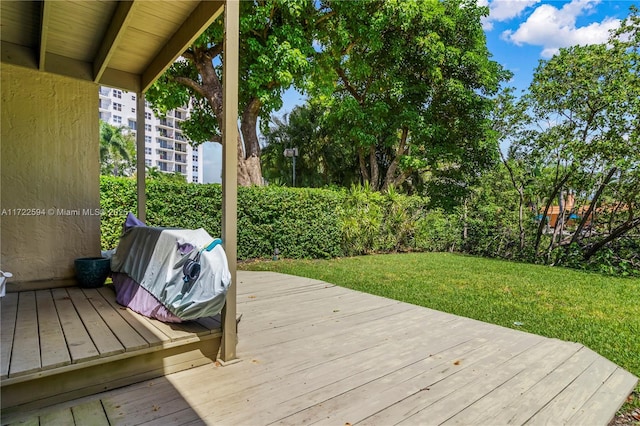 deck featuring a lawn