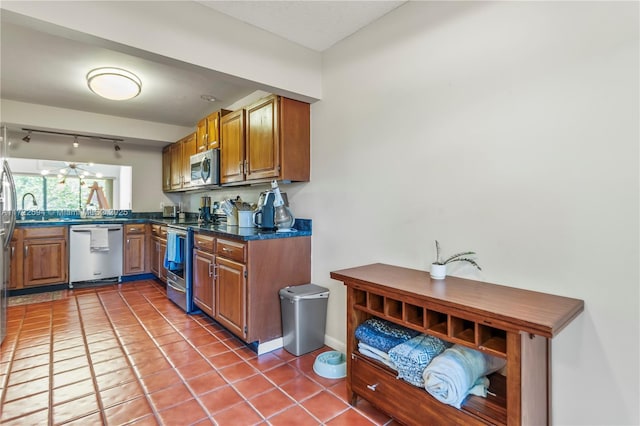 kitchen featuring tile patterned floors and stainless steel appliances