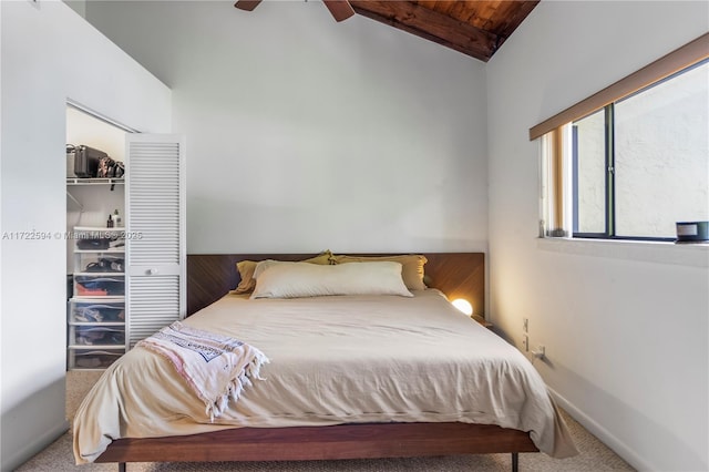 bedroom with carpet flooring, ceiling fan, wooden ceiling, vaulted ceiling, and a closet