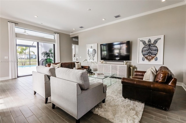 living room featuring crown molding