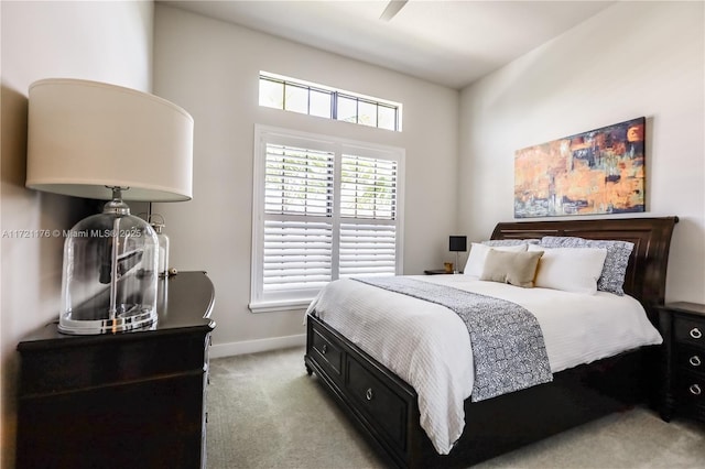 bedroom with light carpet and ceiling fan