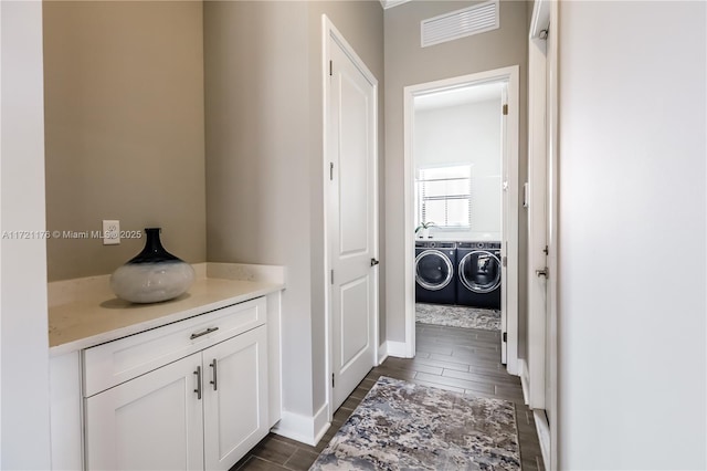 bathroom featuring washer and dryer and vanity