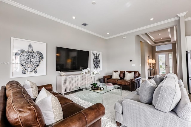 living room featuring crown molding