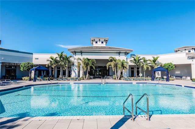 view of swimming pool with a patio