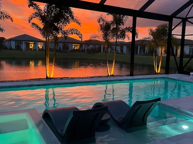 pool at dusk with glass enclosure