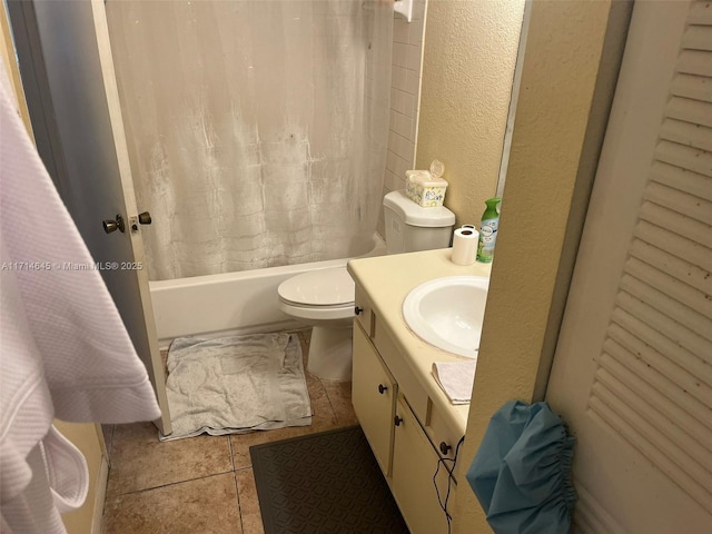 full bathroom with tile patterned floors, vanity, toilet, and shower / bath combo