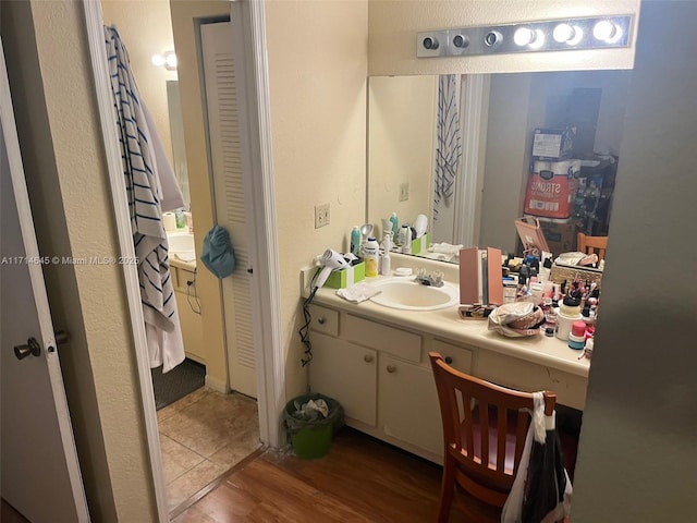 bathroom featuring vanity and hardwood / wood-style flooring