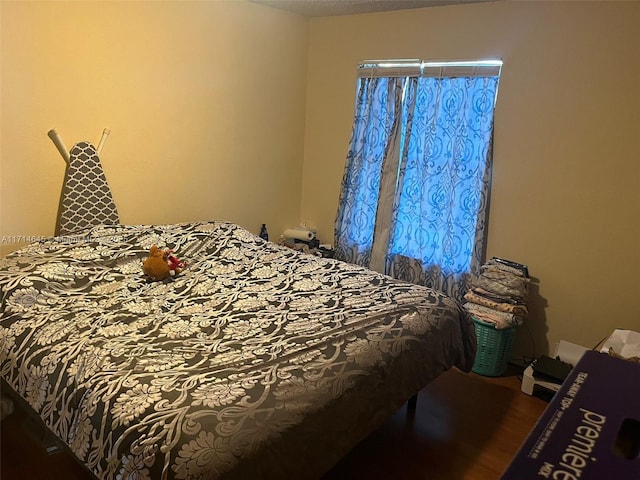 bedroom featuring wood-type flooring