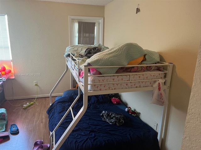 bedroom featuring hardwood / wood-style floors