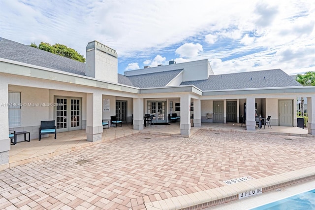 back of house with french doors and a patio