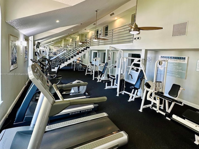 gym featuring ceiling fan and a textured ceiling