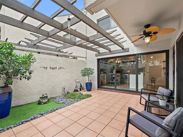 view of patio / terrace featuring ceiling fan and a pergola