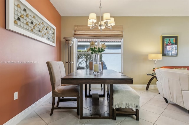 tiled dining area featuring a notable chandelier