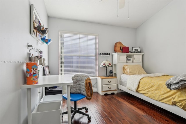 bedroom with ceiling fan and dark hardwood / wood-style floors