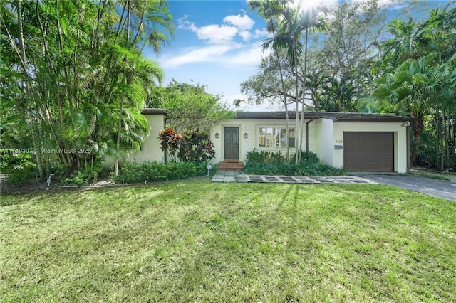 ranch-style house with a front lawn and a garage