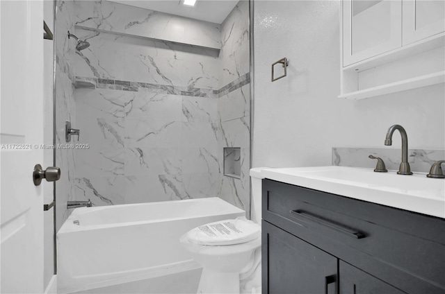 full bathroom with vanity, toilet, and tiled shower / bath combo