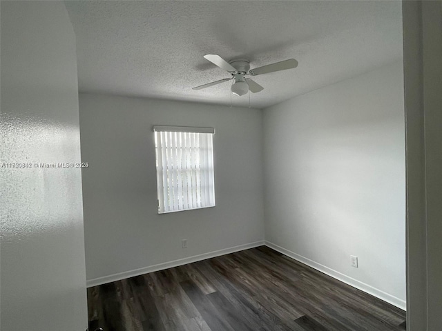 unfurnished room featuring ceiling fan, dark hardwood / wood-style flooring, and a textured ceiling