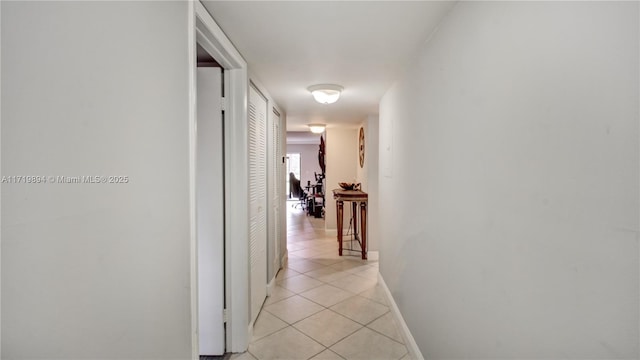 corridor with light tile patterned floors