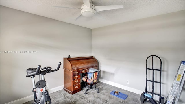 office with a textured ceiling and ceiling fan