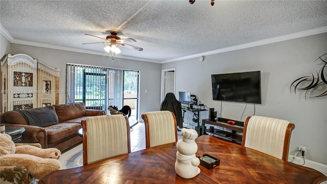 tiled dining room featuring ceiling fan, a textured ceiling, and ornamental molding