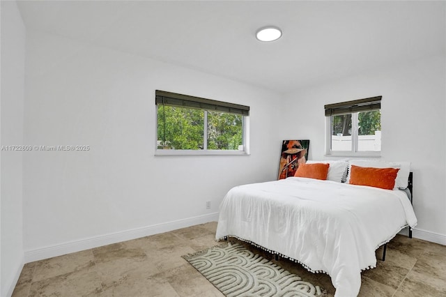 bedroom with multiple windows