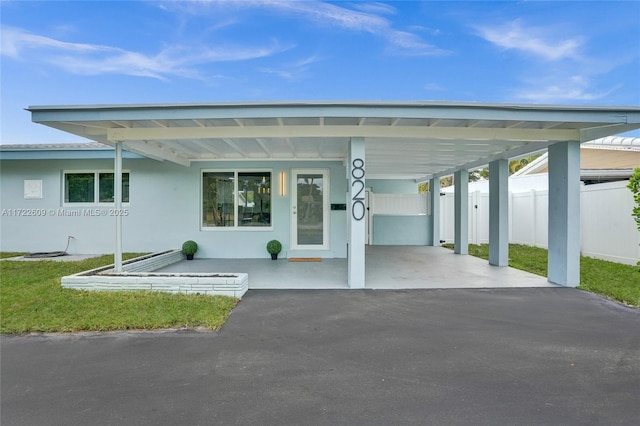 exterior space featuring a carport