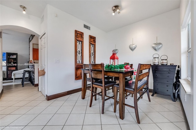 dining space with light tile patterned floors