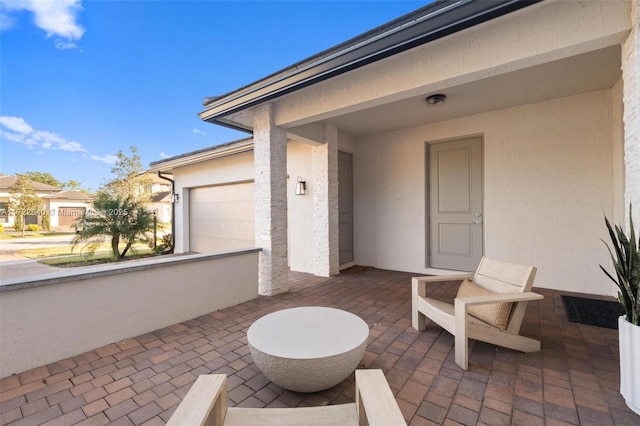 view of patio / terrace with a garage