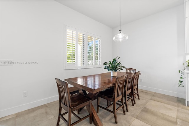 dining area featuring light tile patterned floors