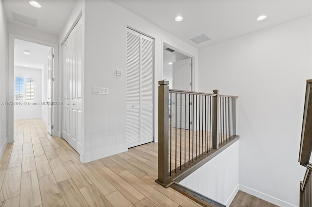 hallway featuring light wood-type flooring