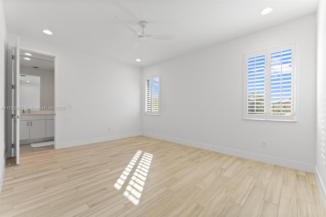 unfurnished bedroom featuring multiple windows, light hardwood / wood-style flooring, and ceiling fan