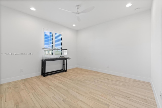 empty room with light hardwood / wood-style floors and ceiling fan