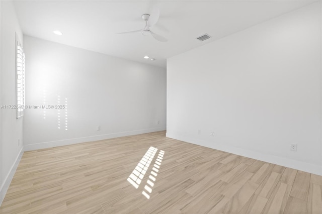 spare room with ceiling fan and light hardwood / wood-style flooring