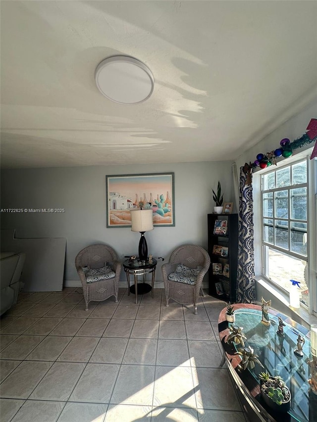 living area featuring light tile patterned floors