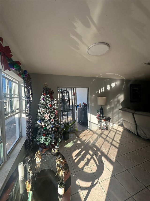 living room with tile patterned floors