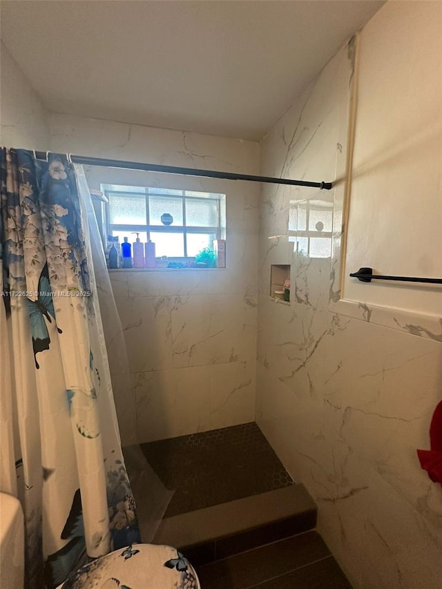 bathroom with a shower with shower curtain