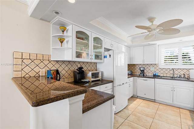 kitchen featuring white cabinetry, white appliances, kitchen peninsula, and light tile patterned flooring