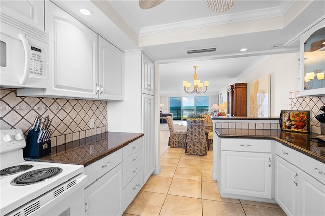 kitchen featuring white cabinets, white appliances, and ornamental molding