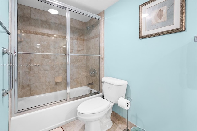 bathroom featuring shower / bath combination with glass door and toilet